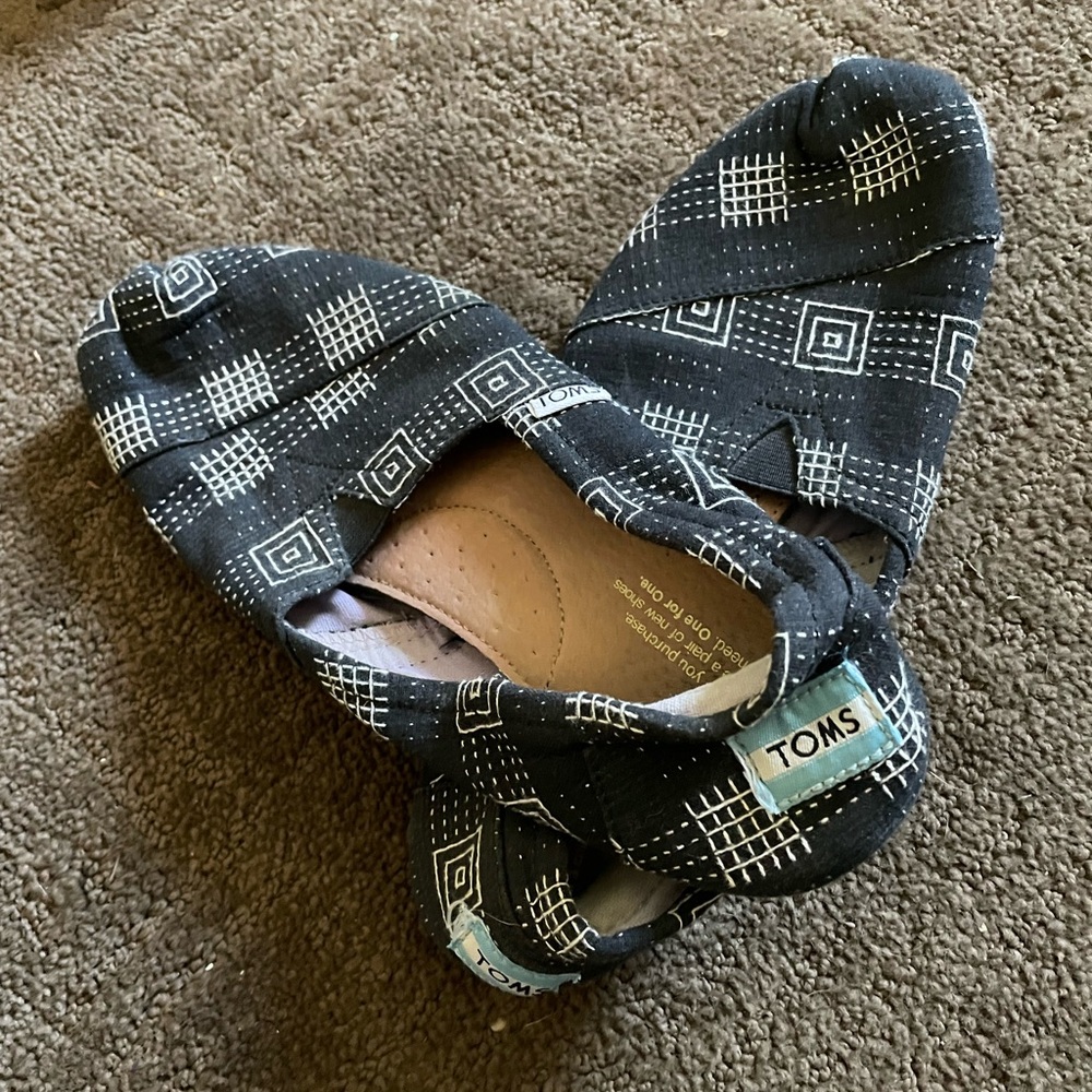 TOMS Black and White Patterned Slip-On Shoes